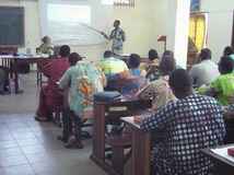 Teaching with the help of an interpreter translating into the Gun language.